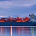 Large LNG (liquid natural gas) tanker at sea at twilight.