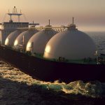 Large LNG (liquid natural gas) tanker at sea at twilight.